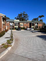 Marks Point — completed paver-block driveway and upgraded landscaping between residential blocks
