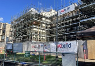 Ways Terrace, Pyrmont — scaffolded heritage building with We Build Australia branded site hoarding mid-construction