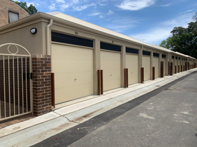 Walker Street, Waterloo — AFTER: new garage roller-door waste enclosure with brick pillars and clean concrete pavement